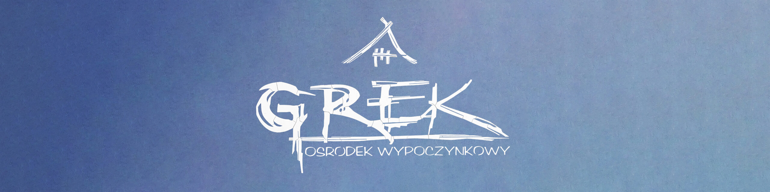 Znak Graficzny GREK namalowany na ścianie ośrodka